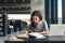 Female student studying at college library