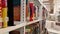 Female student taking book from shelf in library