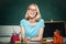 Female student taking notes from a book in college. Student. Portrait of confident young Caucasian female teacher