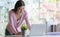 Female student using a laptop to complete a graduation project.She works at home that is modern and comfortable