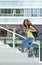 Female student walking up stairs to college