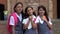 Female Students Making Funny Faces Wearing School Uniforms