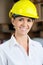 Female Supervisor Wearing Hardhat At Warehouse