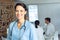 Female surgeon looking at camera in the hospital