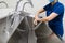 Female surgeon washes hands, preparing for surgery