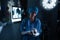 Female surgeon writing on clipboard in operating room at hospital