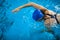 Female swimmer in an indoor swimming pool - doing crawl