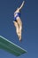 Female Swimmer Jumping On Diving Board