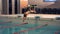 A female swimmer, that jumping and diving into indoor sport swimming pool. Sporty woman.