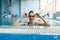 Female swimmer in pool, woman at the poolside