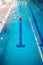 Female swimmer swimming on her back in pool