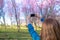 Female take photo of Spring cherry blossom