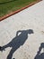 Female tall shadow by the beach