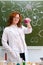 A female teacher conducts chemical experiments in a school classroom. Teaching chemistry at school, lifestyle