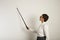 Female teacher with a pointer at white board