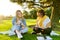 Female teacher psychologist social worker talking to teenage student on the lawn