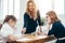 Female teacher pupils school lesson in classroom.