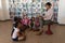 Female teacher reading a story to schoolkids