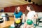 Female teen friends having fun in a bowling alley