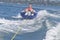 Female teen girl tubing on the river