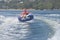 Female teen girl tubing on the river