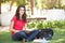 Female Teenage Student Studying In Park