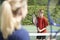 Female Tennis Coach Giving Lesson To Boy