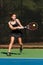 Female Tennis Player Hits Powerful Backhand