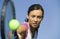 Female Tennis Player Hitting Ball close up of racket focus on player