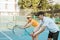 female tennis player holding a racket following the coachs movements