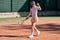 Female tennis player playing game on outdoor court. Athlete caucasian woman with racket