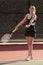 Female Tennis Player Prepares To Serve In Match