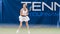 Female Tennis Player Waiting for Ball with a Racquet in Hands During Championship Match