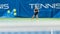 Female Tennis Player Waiting for Opponent to Shoot Ball with a Racquet During Championship Match