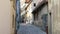 Female Tour Guide dressed in Medieval outfit in the narrow streets of Rothenburg, Germany.