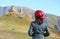 Female Tourist being Impressed by the Gergeti Trinity Church on the Hill against Kazbek Mountain, Stepantsminda, Georg