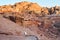 Female Tourist blogger in white dress walk explore around Petra ruins with famous Al-Khazneh