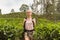 Female tourist enjoying beautiful nature of tea plantations, Sri Lanka.