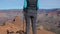 Female Tourist Enjoys The View Of The Grand Canyon From The Height