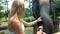 Female Tourist Feeding Elephant