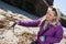 Female tourist finds interesting sea life washed up on the beaches at Point Cabrillo National Monument during low tide in