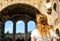 Female tourist in front of the Basilica of Maxentius and Constan