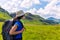 Female tourist hiking in mountains.