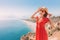 Female tourist looking from the height of the observation viewpoint overlooking Konyaalti beach in Antalya. Tourism and