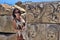 Female tourist near the ruins of ancient buildings