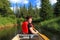 Female tourist paddling a canoe