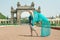 Female tourist in romantic mood walking in colorful clothing near the gates of famous royal Palace of Mysore. India