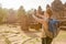 Female tourist with smartphone in Angkor Thom, Cambodia