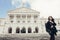 Female tourist standing in front of the Parliament of Portugal, Assembly of the Republic