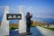 Female tourist taking phot of beautiful view of Hakodate town fr